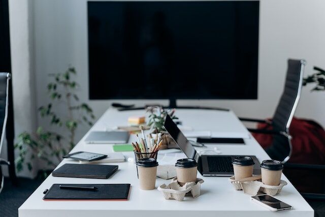 Conference room set up with ergonomic chairs, coffee, and other productivity boosters